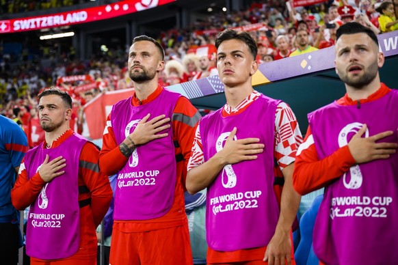 Switzerland&#039;s midfielder Xherdan Shaqiri, forward Haris Seferovic, midfielder Ardon Jashari, and midfielder Renato Steffen, from left to right, react for the national anthem during the FIFA World ...