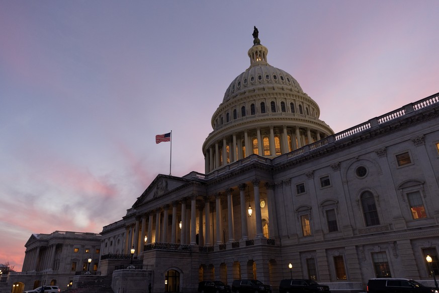 epa11083859 The US Capitol Building is seen at dusk before a Senate vote on Capitol Hill in Washington, DC, USA, 16 January 2024. The Senate is poised to vote whether to to advance a short-term govern ...