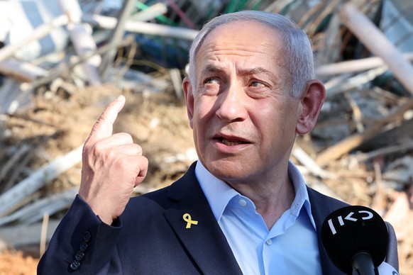 epa12187739 Israel&#039;s Prime Minister Benjamin Netanyahu delivers a statement as he visits the site of the Weizmann Institute of Science, which was hit by Iranian missiles in the central city of Re ...