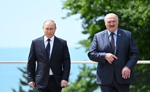 epa09969168 Russian President Vladimir Putin (L) and Belarusian President Alexander Lukashenko (R) attend a meeting at the Bocharov Ruchei residence in the resort city of Sochi, Russia, 23 May 2022. E ...