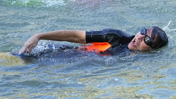 FILE - Paris Mayor Anne Hidalgo swims in the Seine river Wednesday, July 17, 2024 in Paris, France. (AP Photo/Michel Euler, File)