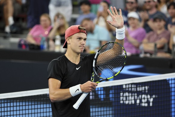 Holger Rune of Denmark waves to the crowd after he won his semi-final match against Roman Safiullin of Russia during the Brisbane International tennis tournament in Brisbane, Australia, Saturday, Jan. ...