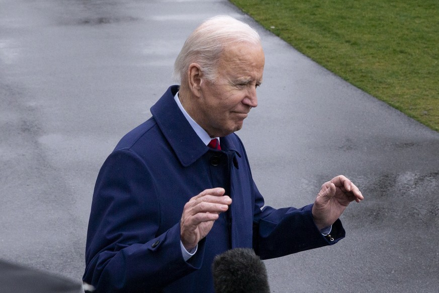 epa10501462 US President Joe Biden reacts to reporters as he walks across the South Lawn of the White House to depart en route to Delaware, in Washington, DC, USA, 03 March 2023. EPA/MICHAEL REYNOLDS