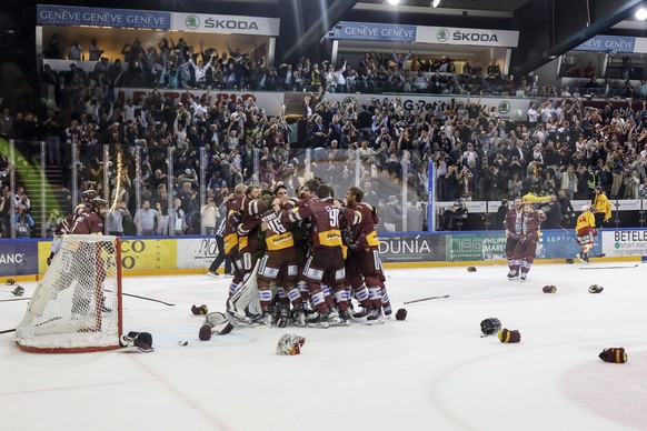 Geneva&#039;s players celebrate as Swiss Champion after winning by 4:1 the seventh and final leg of the ice hockey National League Swiss Championship final playoff game between Geneve-Servette HC and  ...