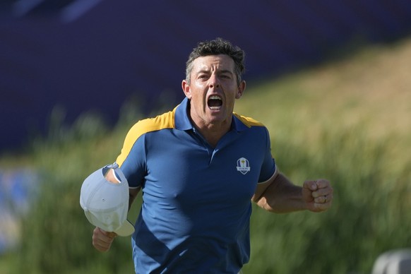 Europe&#039;s Rory McIlroy celebrates after winning his singles match against United States&#039; Sam Burns 3&amp;1 on the 17th green at the Ryder Cup golf tournament at the Marco Simone Golf Club in  ...