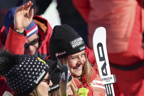 Switzerland&#039;s Corinne Suter waves in the finish area after completing the alpine ski, women&#039;s World Championship downhill, in Meribel, France, Saturday, Feb. 11, 2023. (AP Photo/Marco Trovat ...