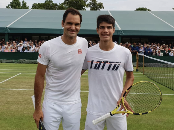 «Carlitos» avec Federer, lors d'un échauffement à Wimbledon il y a trois ans.