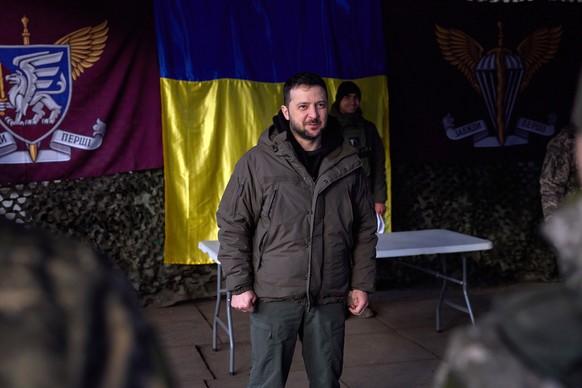 epa10351966 A handout photo made available by the Ukrainian Presidential Press Service shows Ukrainian President Volodymyr Zelensky awarding troops in Sloviansk, Donetsk area, Ukraine, 06 December 202 ...