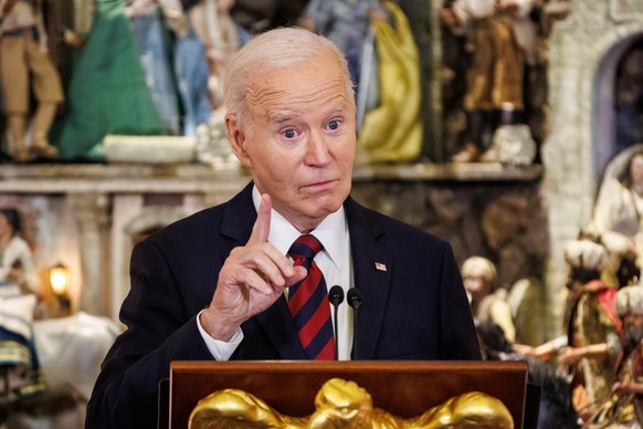 epa11769707 US President Joe Biden speaks at a Christmas for All Dinner in Celebration of Unity, America, and Special Olympics in the East Room of the White House in Washington, DC, USA, 10 December 2 ...