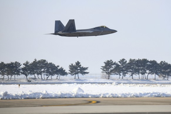 In this photo provided by South Korean Defense Ministry, A U.S. F-22 fighter jet prepares to land during the joint air drills with South Korea in Gunsan, South Korea, Tuesday, Dec. 20, 2022. The Unite ...