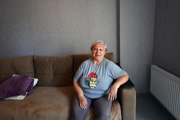 Galina Giller, the 67-year-old pensioner, is seen in her new one-bedroom flat she was given for free by the Moscow-installed authorities in May 2024, in the Russian-controlled Azov Sea port city of Ma ...
