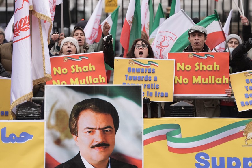 Activists from the Association of Anglo-Iranian Women in the UK show solidarity with the protests in Iran during a rally outside 10 Downing Street, in London, Sunday Jan. 11, 2026. (Stefan Rousseau/PA ...