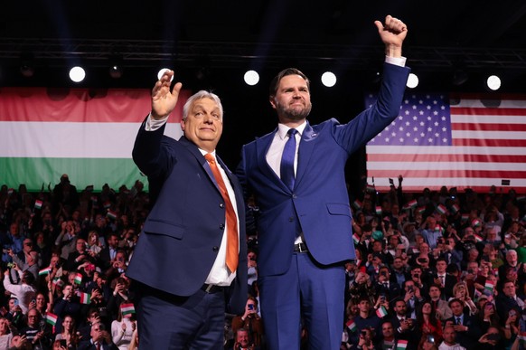U.S. Vice President JD Vance and Hungarian Prime Minister Viktor Orban, left, wave to the audience during a Day of Friendship event in Budapest, Hungary Tuesday, April 7, 2026. (Jonathan Ernst/Pool Ph ...