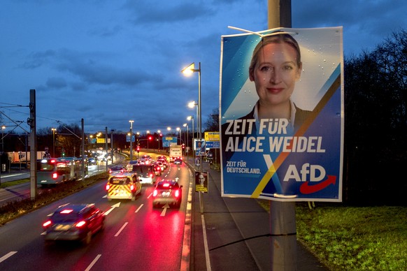 An election poster showing AfD top candidate Alice Weidel is fixed high up on a lamp pole in Frankfurt, Germany, Tuesday, Jan. 28, 2025. (AP Photo/Michael Probst)