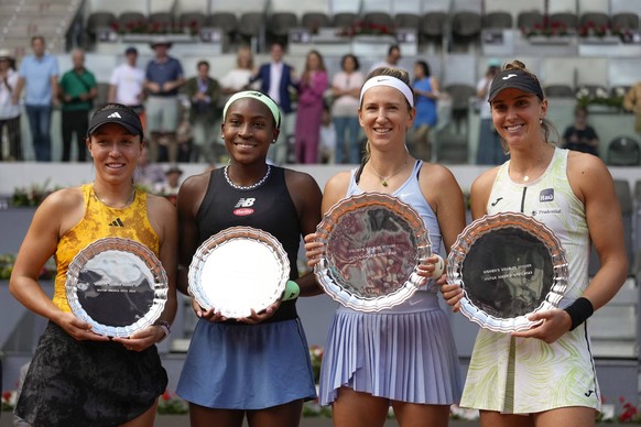 Doubles finalists L-R Jessica Pegula and Coco Gauff of the U.S. pose next to winners Victoria Azarenka of Belarus and Beatriz Haddad Maia of Brazil after the women s doubles final in the Mutua Madrid  ...
