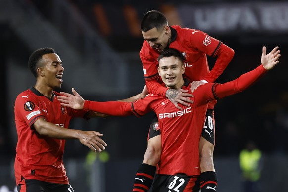 Rennes&#039; Fabian Rieder, centre right, celebrates after scoring the opening goal during the Europa League Group F soccer match between Rennes and Panathinaikos at the Roazhon Park stadium in Rennes ...