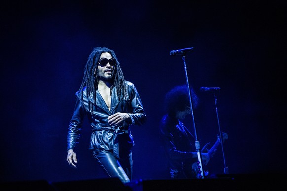 epa11447058 US singer-songwriter Lenny Kravitz (L) performs on stage at the Tinderbox music festival in Odense, Denmark, early 30 June 2024. The festival runs from 27 to 29 June 2024. EPA/HELLE ARENSB ...