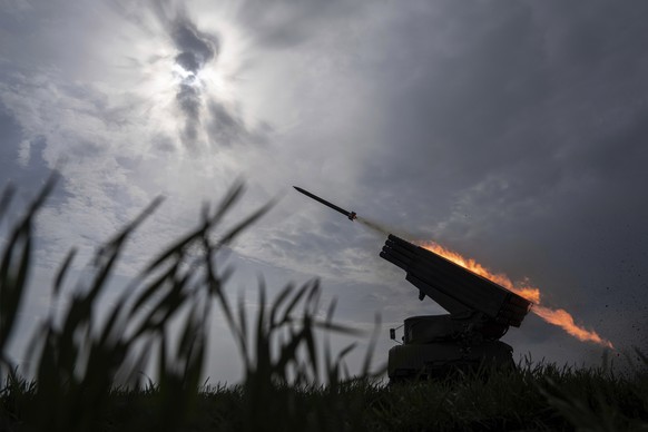 A Ukrainian MSLR BM-21 &quot;Grad&quot; fires towards Russian positions, at the frontline in Donetsk region, Ukraine, on Saturday, April 8, 2023. (AP Photo/Evgeniy Maloletka)