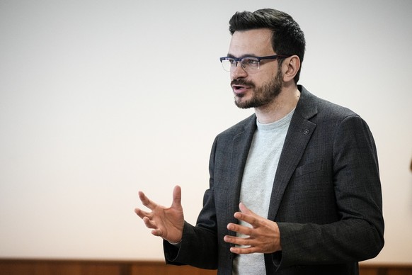 Ilya Yashin, Russian opposition activist and a municipal deputy of the Krasnoselsky district of Moscow, gestures speaking during a session in a courtroom in Moscow, Russia, Wednesday, May 25, 2022. Ya ...