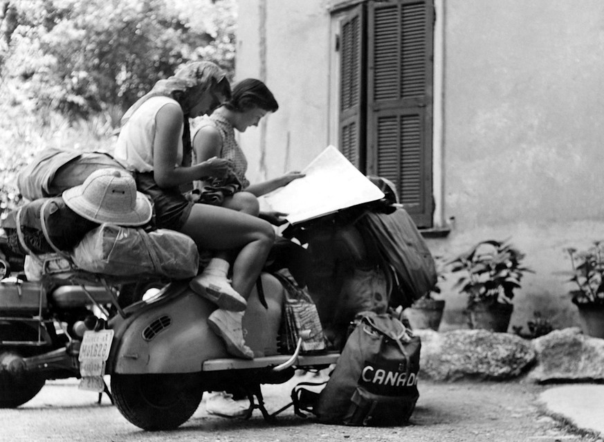 1957: Young women: Road trip on a Lambretta scooter. 1957 01 02 1957 972_45_W277889