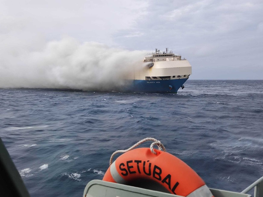 FILE - In this undated photo provided by the Portuguese Navy on Feb. 18, 2022, smoke billows from the burning Felicity Ace car transport ship as seen from the Portuguese Navy NPR Setubal ship southeas ...