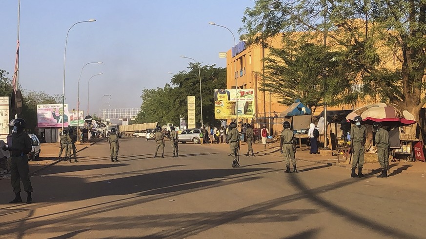 epa09032178 Police seal off a road during clashes with Niger's opposition supporters protesting against presidential run-off results in Niamey, Niger, 23 February 2021. According to provisional r ...