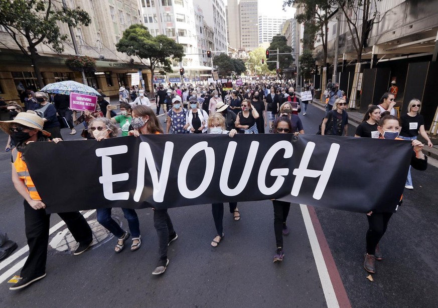 Thousands of people with placards and banners rally demanding justice for women in Sydney, Monday, March 15, 2021, as the government reels from two separate allegations. The rally was one of several a ...