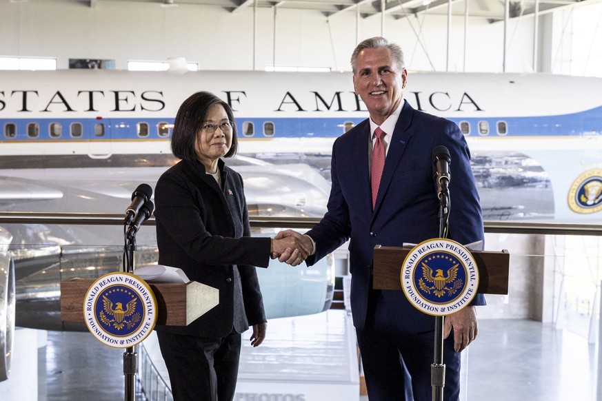 epa10560567 U.S. House speaker Kevin McCarthy (R) and Taiwanese President Tsai Ing-wen shake hands after holding a press conference following a bilateral meeting at the Ronald Reagan Presidential Libr ...