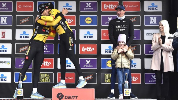 First place, France&#039;s Christophe Laporte of the Jumbo Visma team, center, is congratulated by second place, Belgium&#039;s Wout Van Aert of the Jumbo Visma team, left, as they pose on the podium  ...