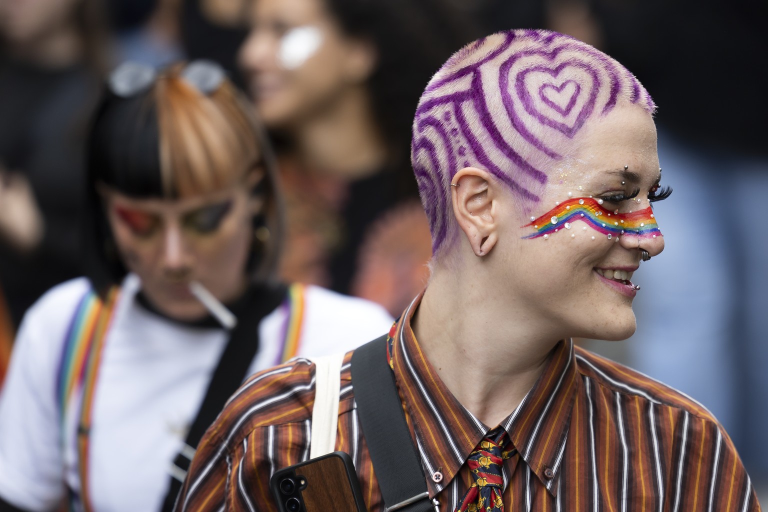 People take part in a pride parade in Bern, Switzerland, Saturday, August 2, 2025. (KEYSTONE/Peter Klaunzer)