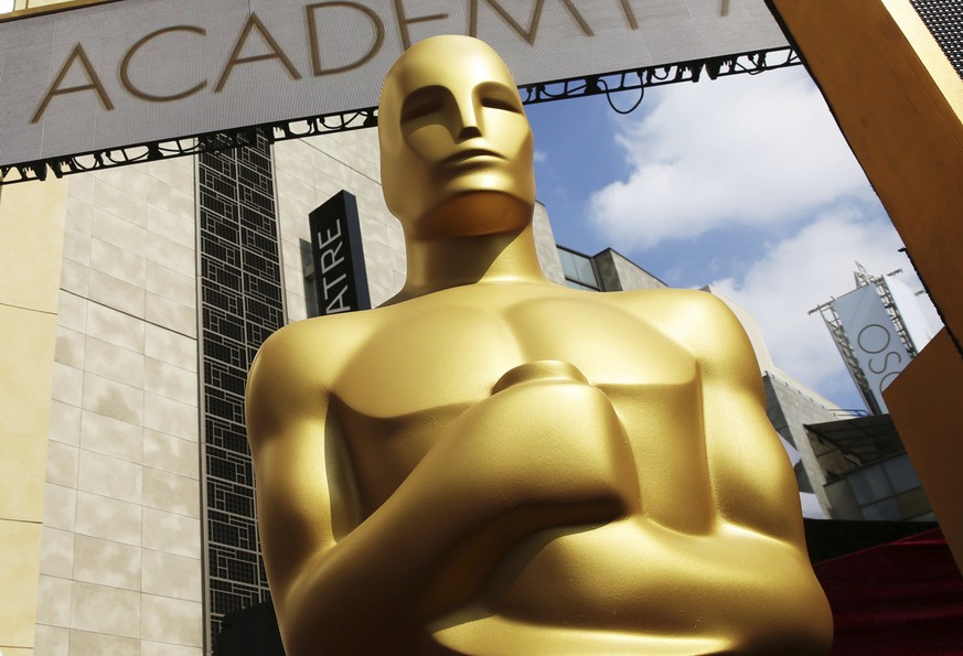 FILE - An Oscar statue appears outside the Dolby Theatre for the 87th Academy Awards in Los Angeles on Feb. 21, 2015. After two years of tweaking rules because of the pandemic, including allowing film ...