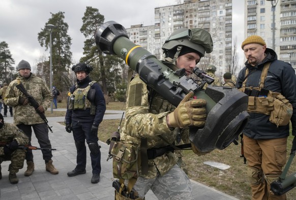 FILE - A Ukrainian Territorial Defence Forces member holds an NLAW anti-tank weapon, in the outskirts of Kyiv, Ukraine, March 9, 2022. (AP Photo/Efrem Lukatsky, File)