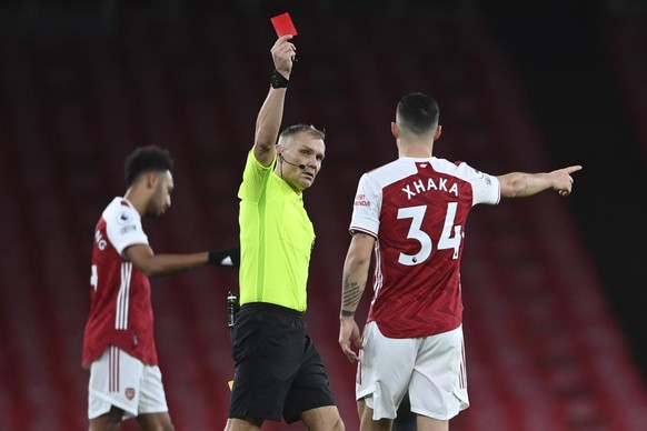 Arsenal&#039;s Granit Xhaka is shown a red card by the referee and sent off during an English Premier League soccer match between Arsenal and Burnley at the Emirates stadium in London, England, Sunday ...