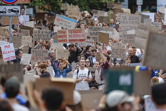 epa13131086 Ukrainians hold placards reading 'Fedorov is the defence minister', 'Don't mess with what works', 'Hands off Fedorov' and 'Bring Fedorov back', ...