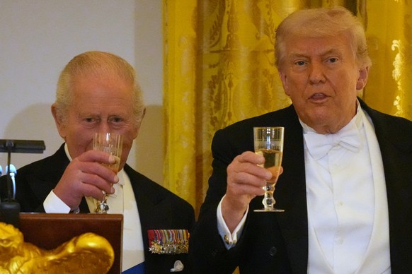 Britain's King Charles III toasts with President Donald Trump during a State Dinner with first lady Melania Trump and Queen Camilla in the East Room of the White House State Dinner Tuesday, April ...