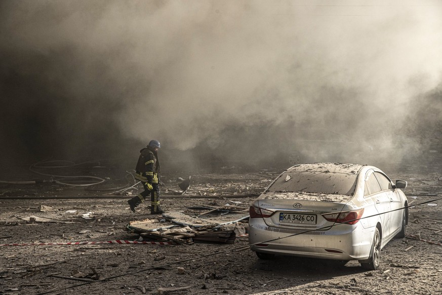 KYIV, UKRAINE - OCTOBER 17: Firefighters conduct work after the Russian drone attacks in Kyiv, Ukraine on October 17, 2022. At least 4 separate explosions were heard in Kyiv, while authorities reporte ...