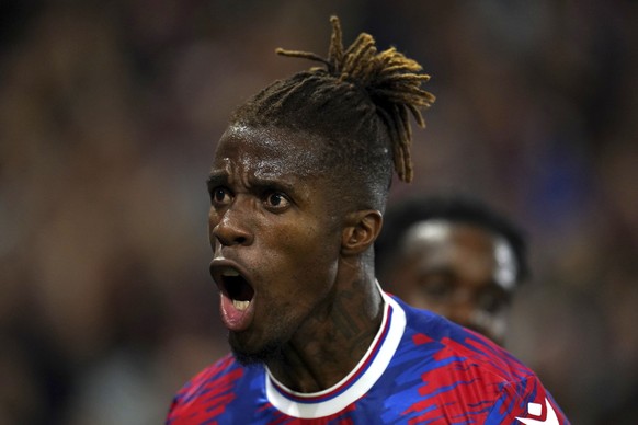 Crystal Palace&#039;s Wilfried Zaha celebrates scoring the opening goal during the English Premier League soccer match between Crystal Palace and Brentford at Selhurst Park, London, Tuesday Aug. 30, 2 ...