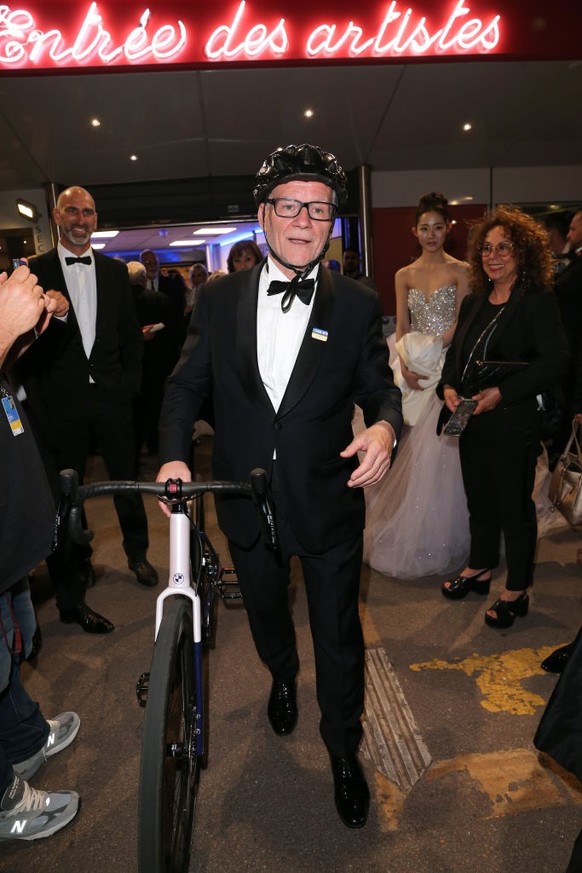 CANNES, FRANCE - MAY 16: Thierry Fremaux with his bicycle leaves the &quot;Jeanne du Barry&quot; the screening and premiere at the 76th annual Cannes film festival at Palais des Festivals on May 16, 2 ...
