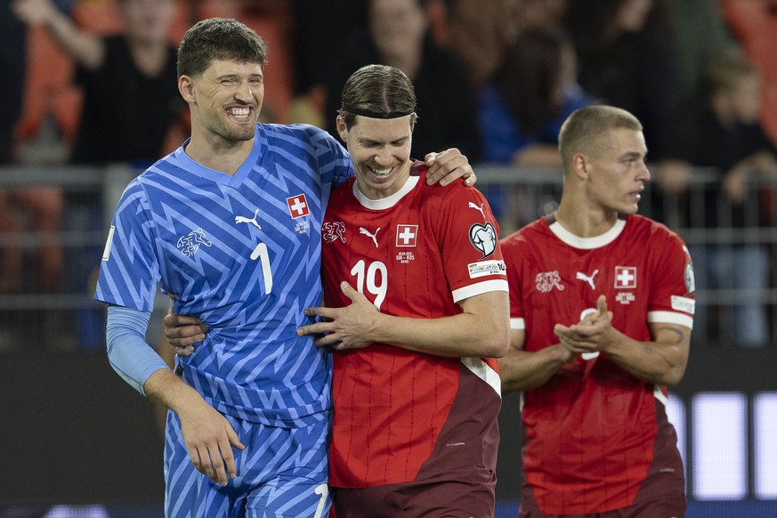 Switzerland&#039;s goalkeeper Gregor Kobel, Cedric Itten and Miro Muheim, from left, celebrate during the FIFA 2026 World Cup Group B qualifying soccer match between Switzerland and Kosovo at the St.  ...