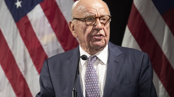 FILE - In this Oct. 30, 2018 file photo, Rupert Murdoch introduces Secretary of State Mike Pompeo during the Herman Kahn Award Gala, in New York. The richest 25 Americans pay less in tax �?? 15.8% of  ...