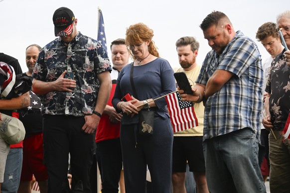 People attend a vigil at Timpanogos Regional Hospital for Charlie Kirk, the CEO and co-founder of Turning Point USA who was shot and killed, Wednesday, Sept. 10, 2025, in Orem, Utah. (AP Photo/Alex Go ...