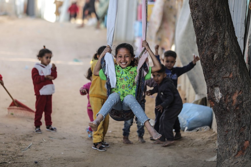 Eid Al-Fitr In Gaza City Palestinian children play on the first day of the Muslim holiday of Eid al-Fitr in Gaza city on May 2, 2022. Muslims worldwide celebrate Eid al-Fitr marking the end of the fas ...