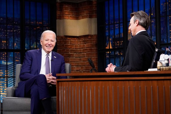 LATE NIGHT WITH SETH MEYERS -- Episode 1488 -- Pictured: (l-r) President Joe Biden talks with host Seth Meyers on February 26, 2024 -- (Photo by: Lloyd Bishop/NBC via Getty Images)