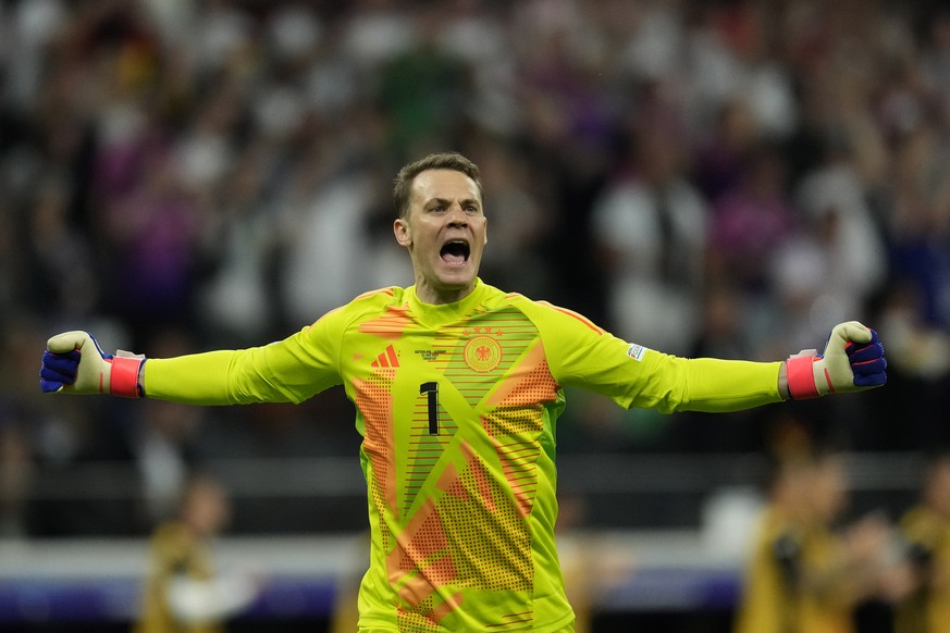 Germany&#039;s goalkeeper Manuel Neuer reacts to a goal attempt by his teammate during a Group A match between Switzerland and Germany at the Euro 2024 soccer tournament in Frankfurt, Germany, Sunday, ...