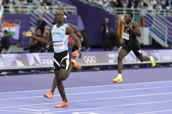 Letsile Tebogo, of Botswana, celebrates after winning the men&#039;s 200-meter final at the 2024 Summer Olympics, Thursday, Aug. 8, 2024, in Saint-Denis, France. (AP Photo/Matthias Schrader)