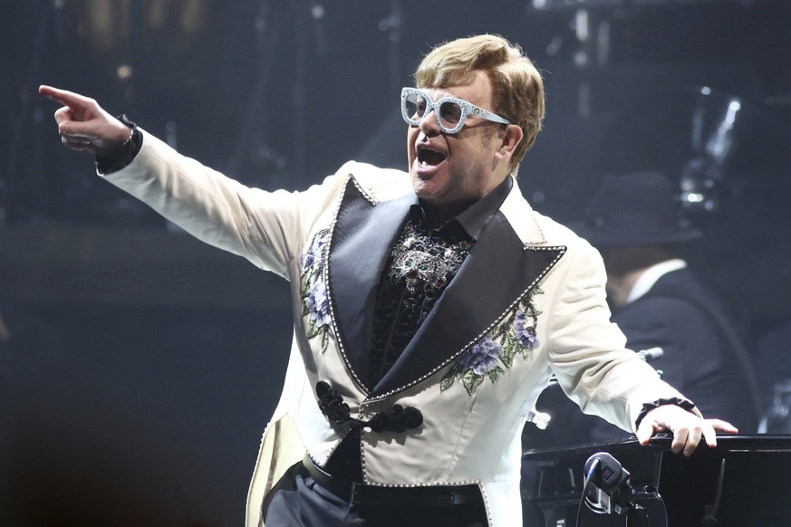 Elton John performs at Madison Square Garden during his Farewell Yellow Brick Road Tour on Tuesday, Feb. 22, 2022, in New York. John credits Ryan White and his family with saving his life. The singer  ...