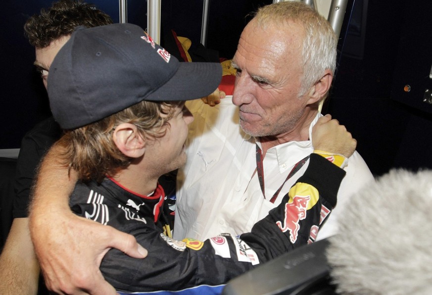 Red Bull driver Sebastian Vettel of Germany, left, and Dietrich Mateschitz of Austria, team owner of Red Bull and Toro Rosso F1 teams, right, celebrate after Vettel became Formula One World Champion 2 ...