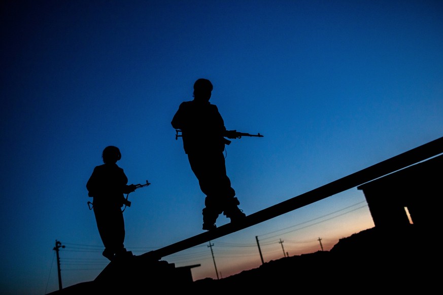 PKK Fighting ISIS Two PKK fighters were at training time in their base on the frontline with ISIS at Daqoq south of Kirk PKK Fighting ISIS Two PKK fighters were at training time in their base on the f ...