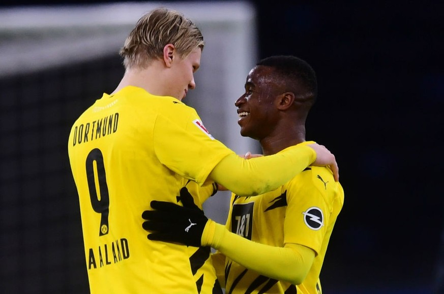 BERLIN, GERMANY - NOVEMBER 21: Erling Haaland (L) and Youssoufa Moukoko of Dortmund chat after the Bundesliga match between Hertha BSC and Borussia Dortmund at Olympiastadion on November 21, 2020 in B ...