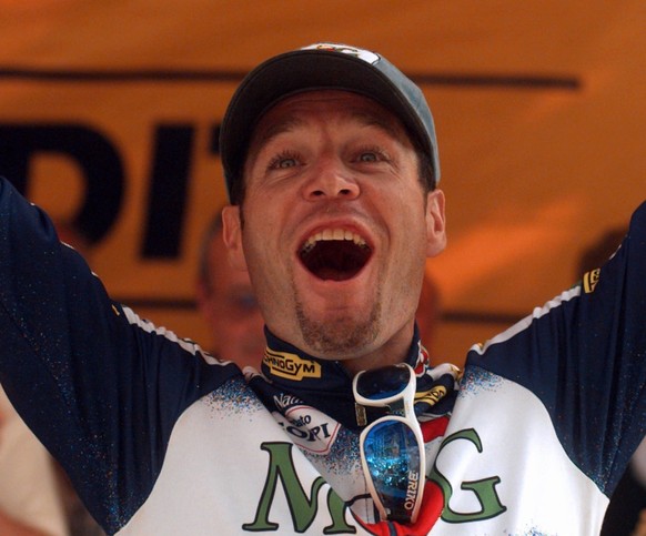 Pascal Richard of Switzerland waves on the podium after he won the 12th stage of the Tour de France cycling race between Valence and Le Puy en Velay, central France Friday July 12, 1996. (AP Photo/Lau ...
